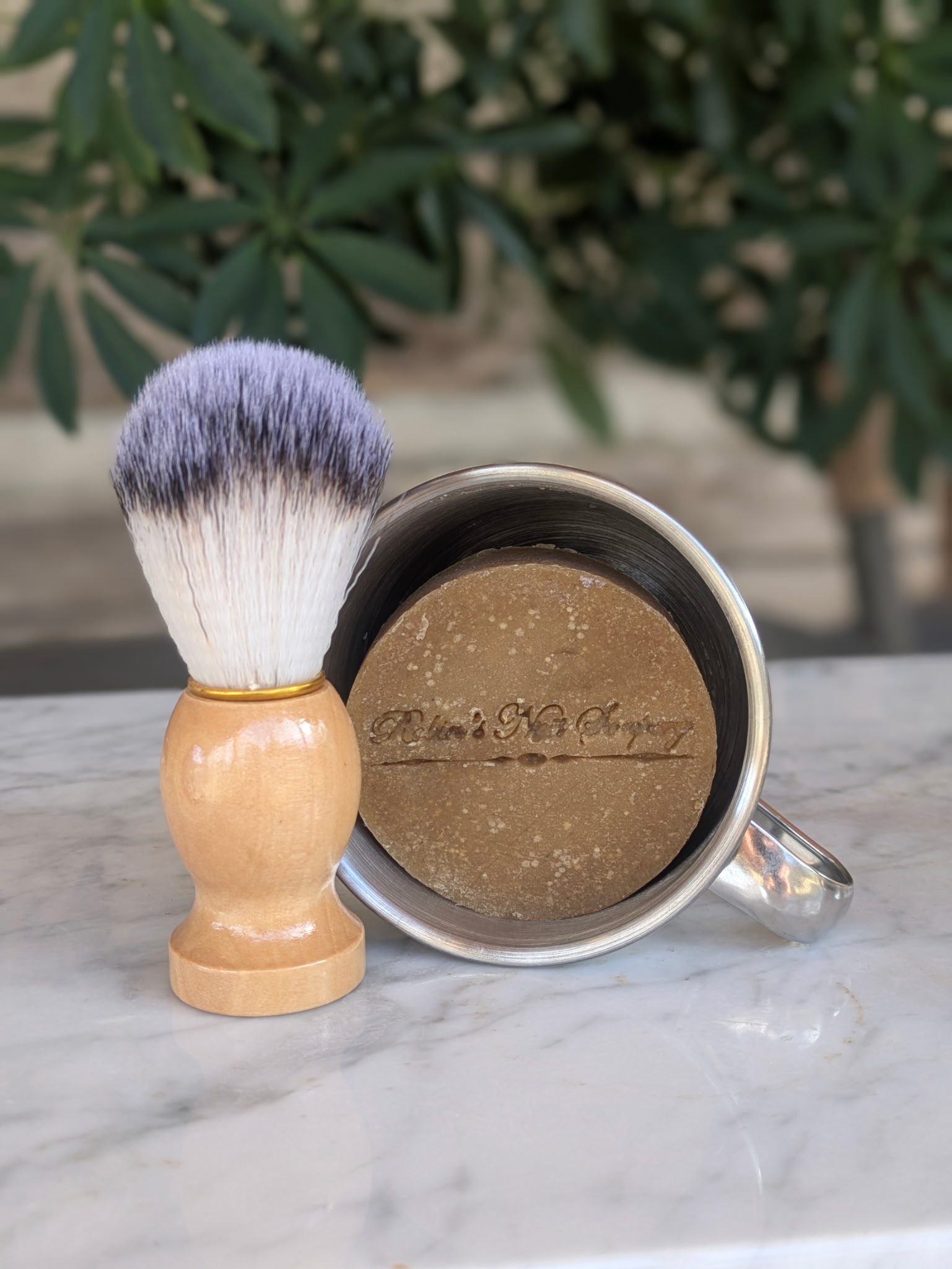 Shaving Cream in a Mug with a Brush